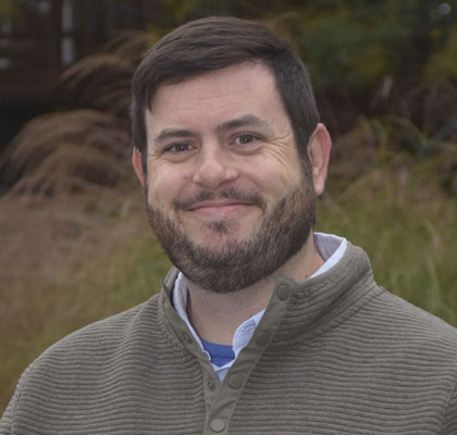 Man in grey sweater