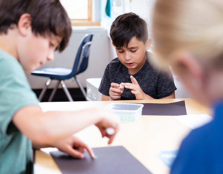 Children working at desk together