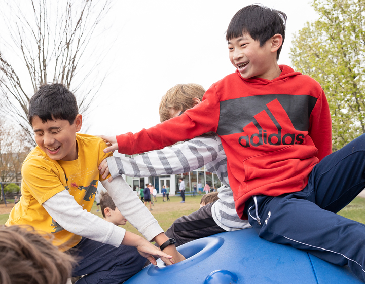 Two boys playing on a playground