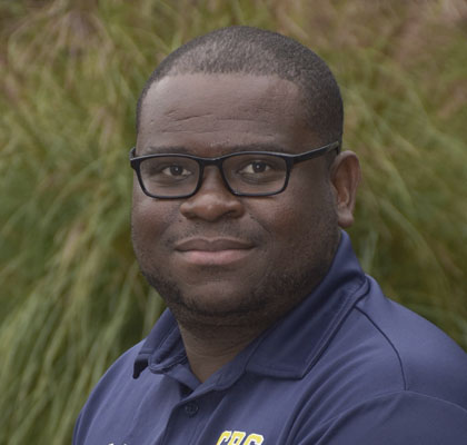 Man in navy collared shirt