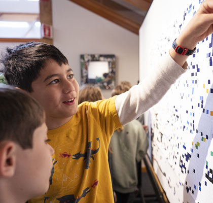 Boys working on puzzle