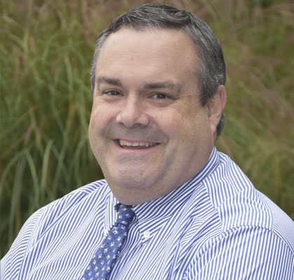 Man with blue tie and collared shirt