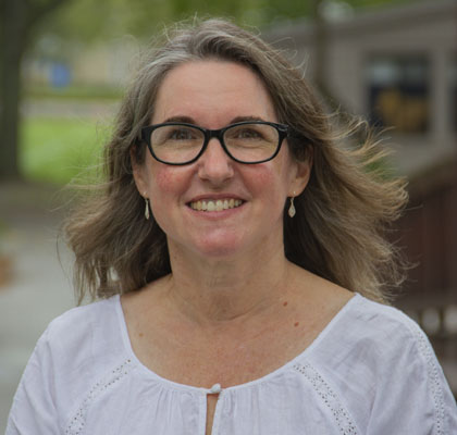 Woman with glasses and white shirt