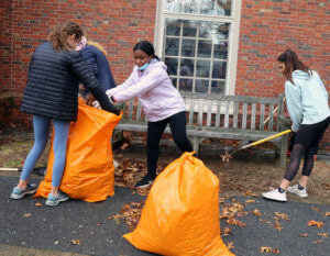 Students cleaning outside