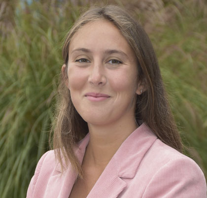 Woman in pink blazer