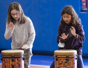 girls playing the drums 