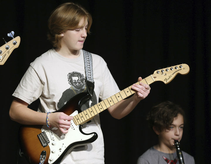 student playing guitar