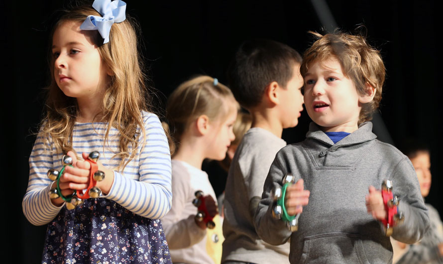 children holding bells