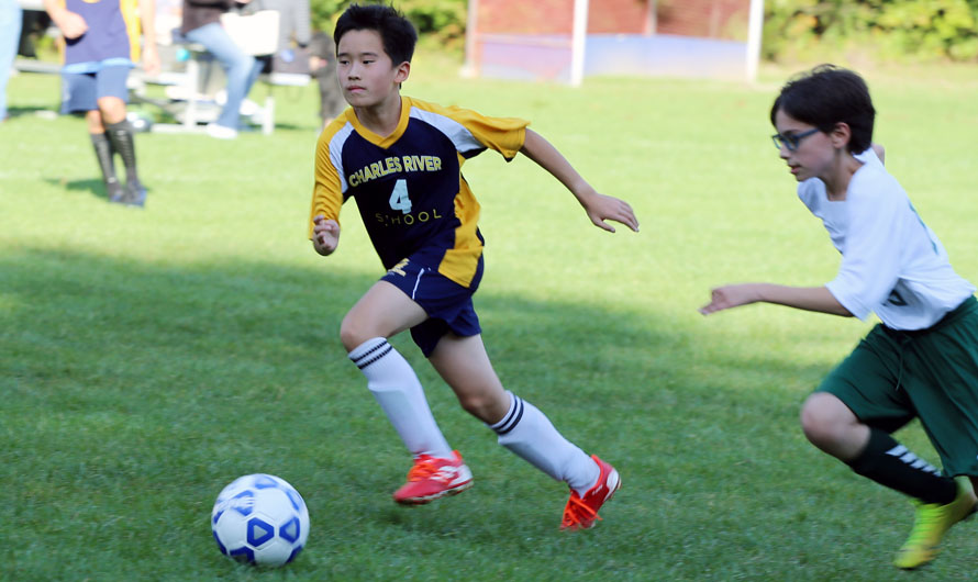 Boy playing soccer