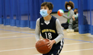 boy playing basketball