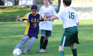 Boy playing soccer