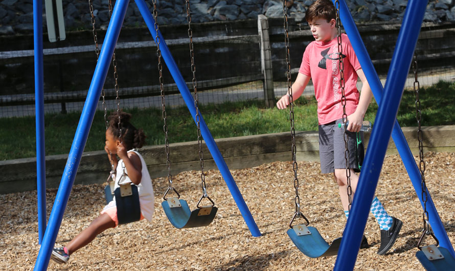 children playing on swings