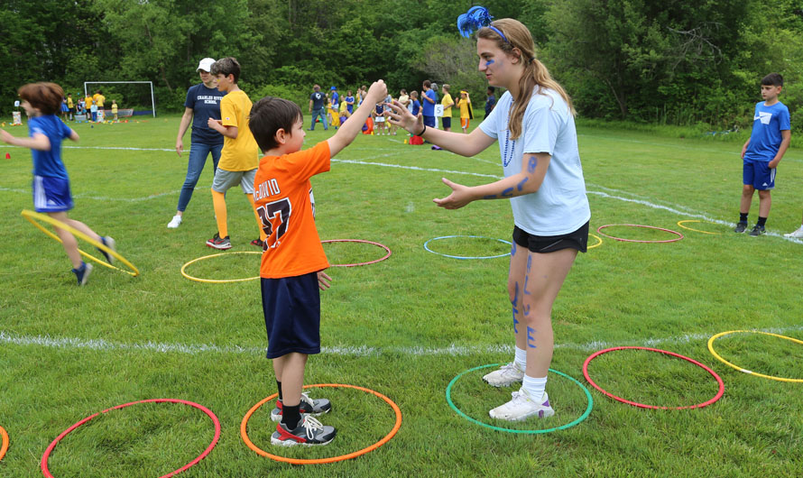 girl and boy playing rocks paper scissors