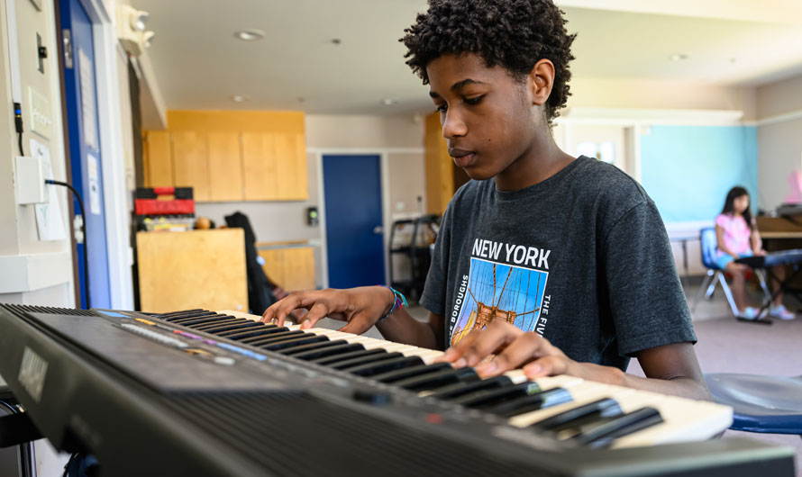 boy playing piano