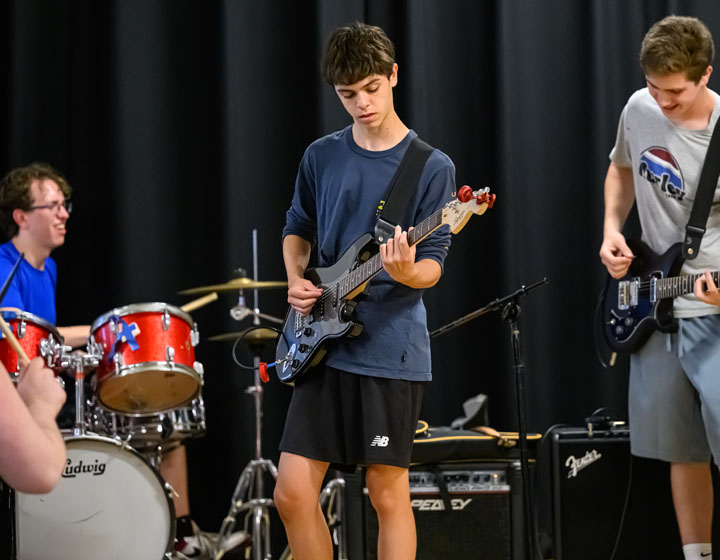 boy playing the guitar