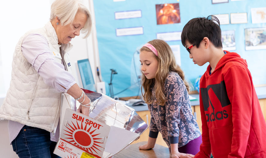 Teacher with two students