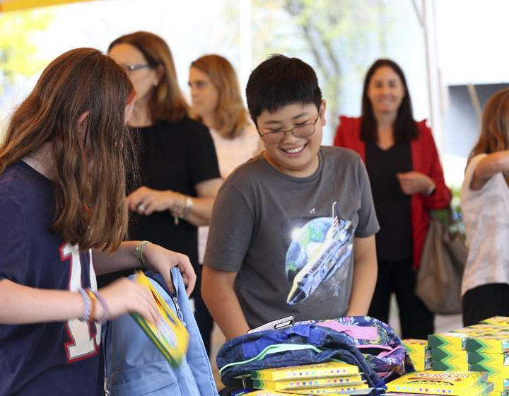 children smiling at community service event