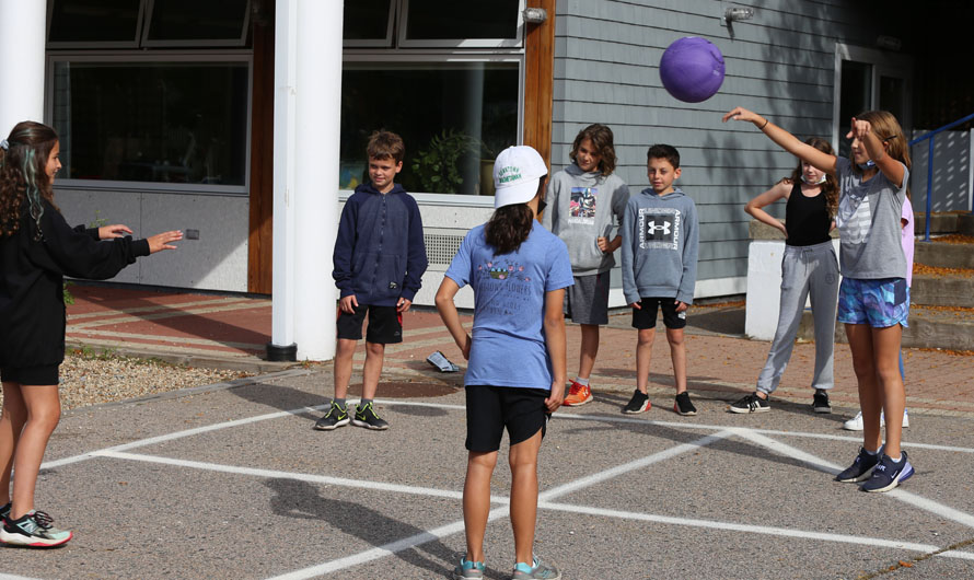 children playing with a ball outside