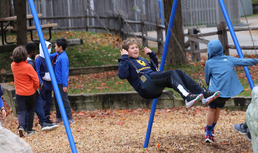 boy swinging on a swing