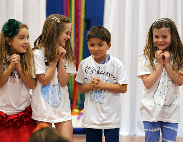 four children performing