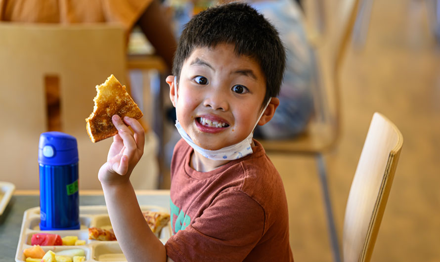boy eating pizza