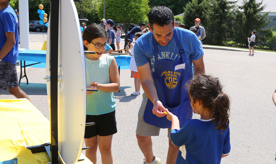 adult helping a little girl