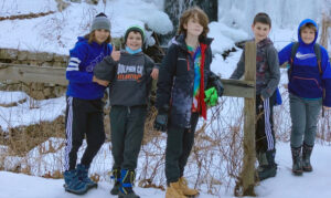 kids on a hike in the snow 