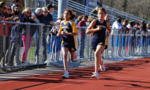 girls running on a track 