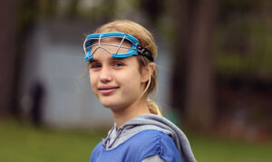 girls wearing lacrosse goggles