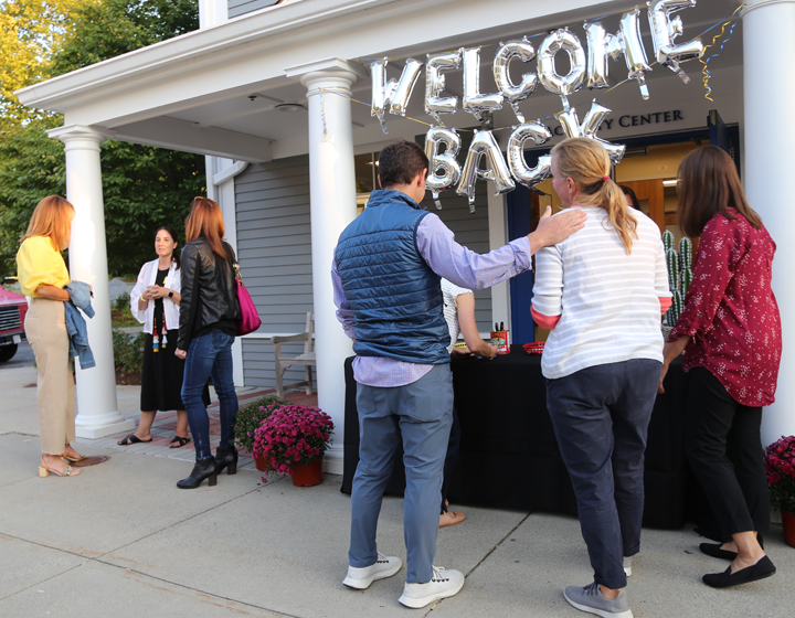 Welcome Back sign at party