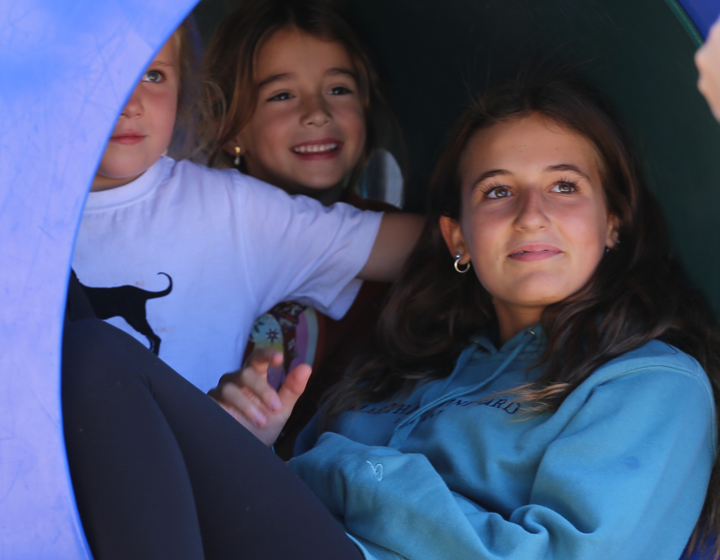 girls smiling in tunnel