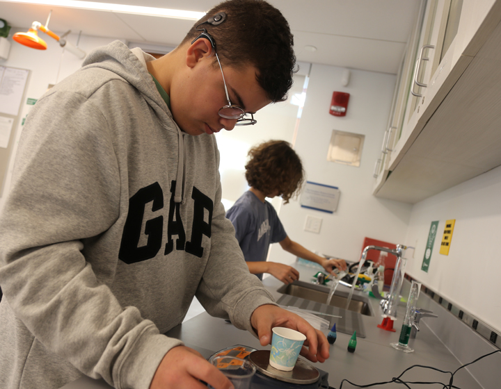boy in science class