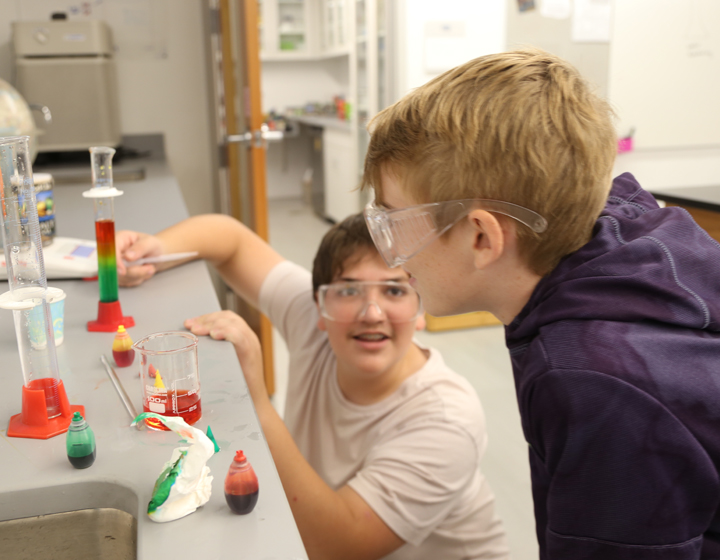 two boys doing science experiment
