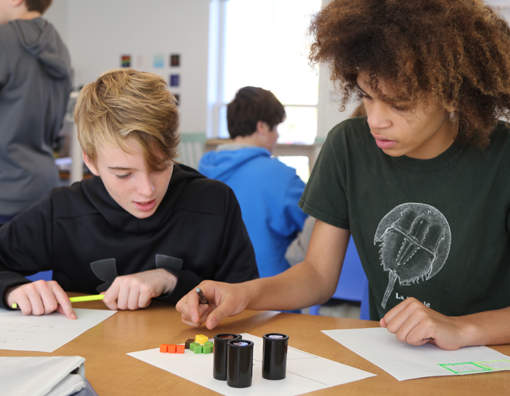 middle school students working on a math problem